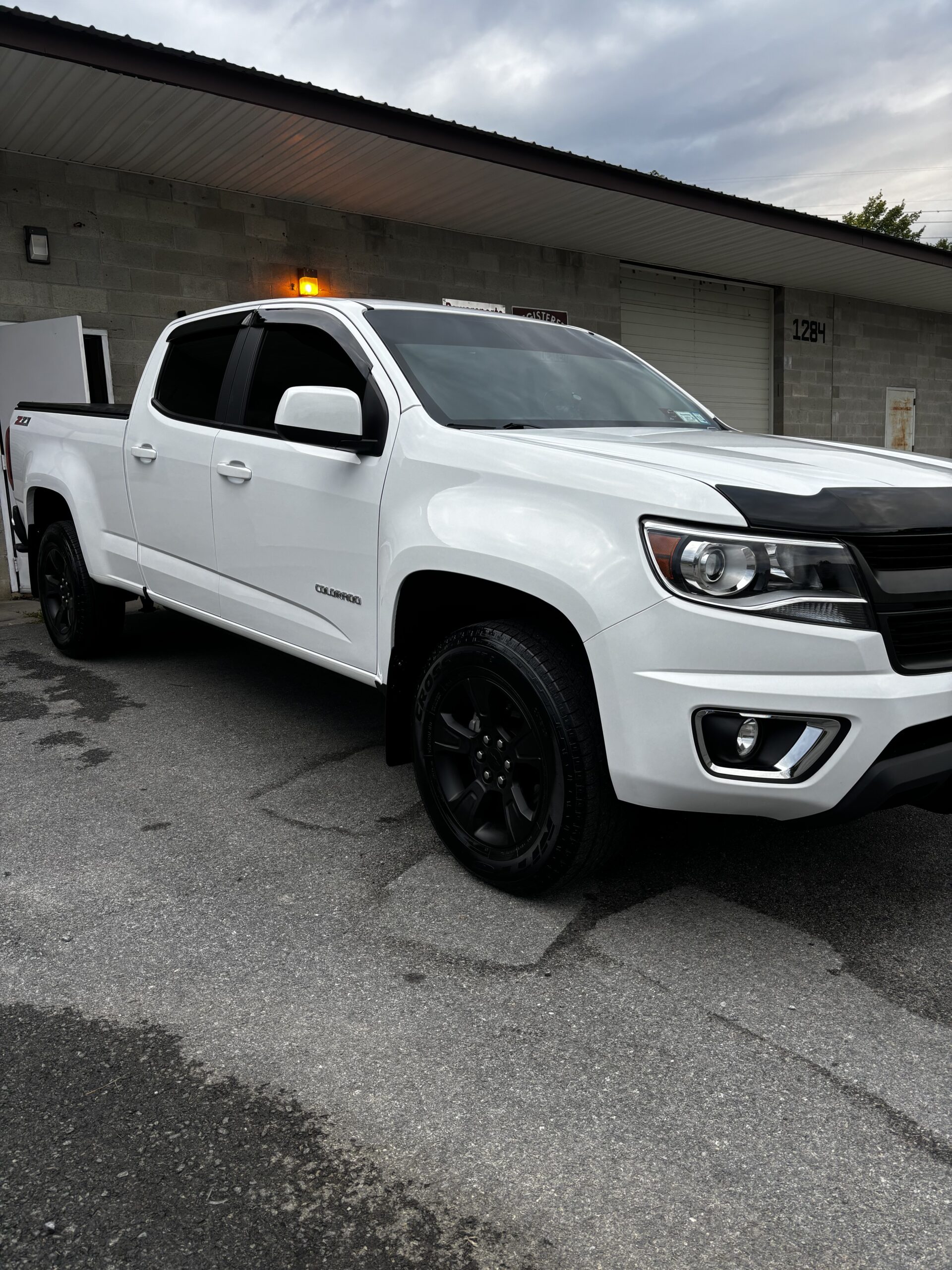 Windshield sunstrip tint add-on to reduce glare