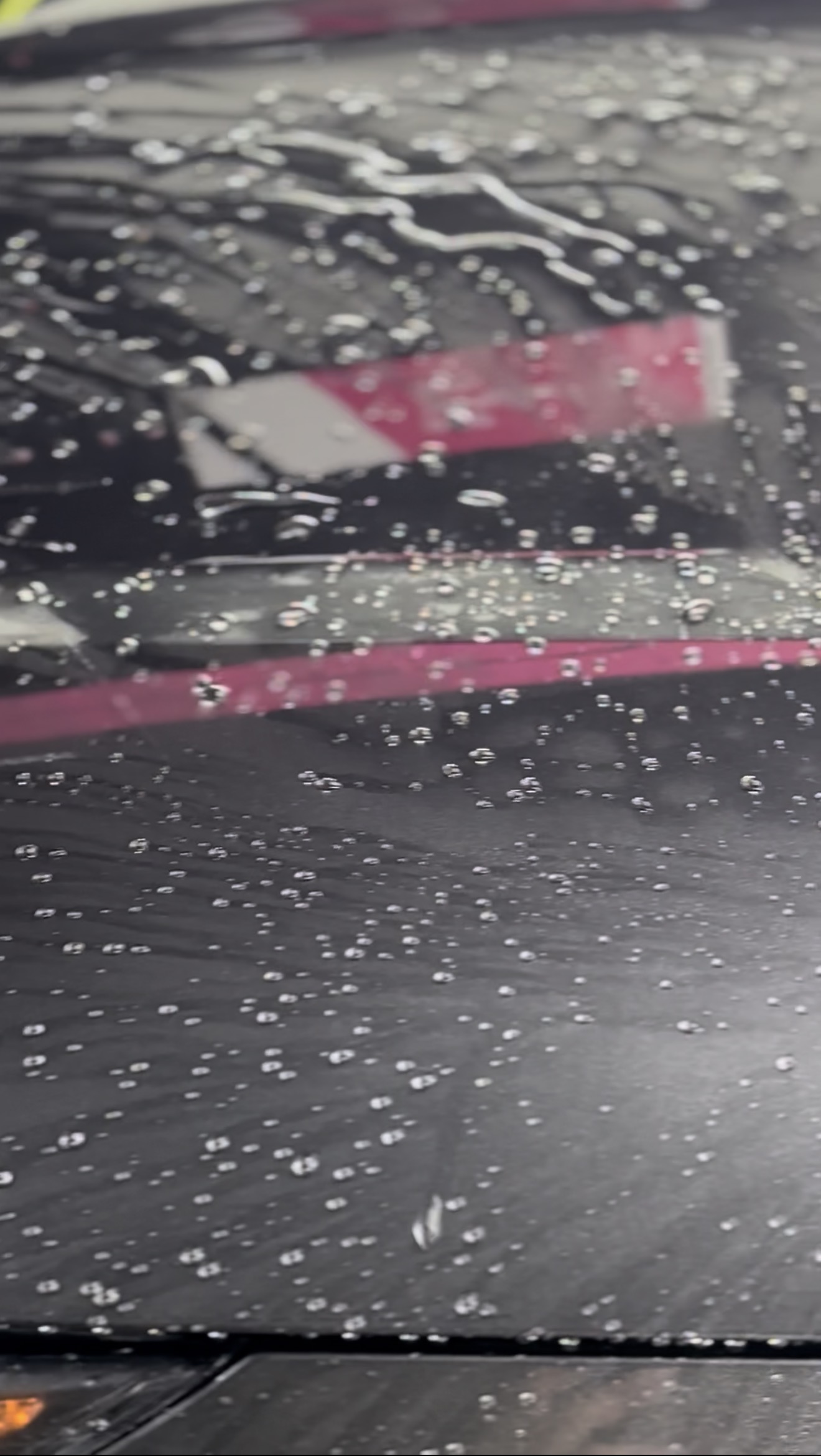 Hydrophobic ceramic coating water beading on vehicle paint